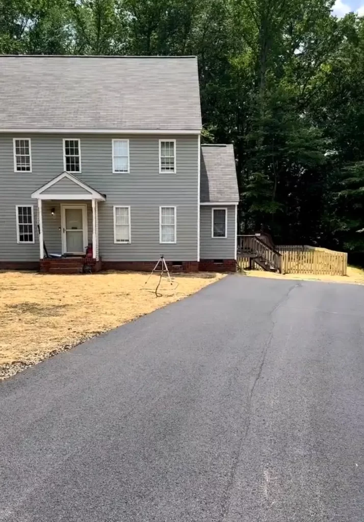 Driveways & Paving in Chesterfield & Richmond | Peachers freshly paved asphalt driveway with reseeded yard in richmond va