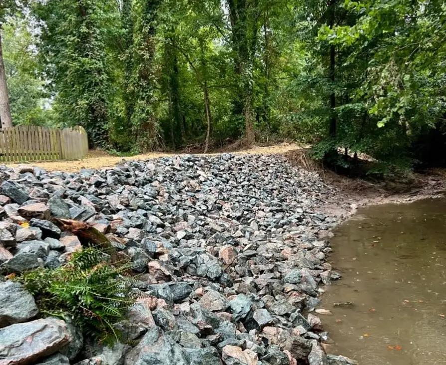 Landscaping Services in Chesterfield & Richmond | Peachers rip rap erosion control on river bank in chesterfield va