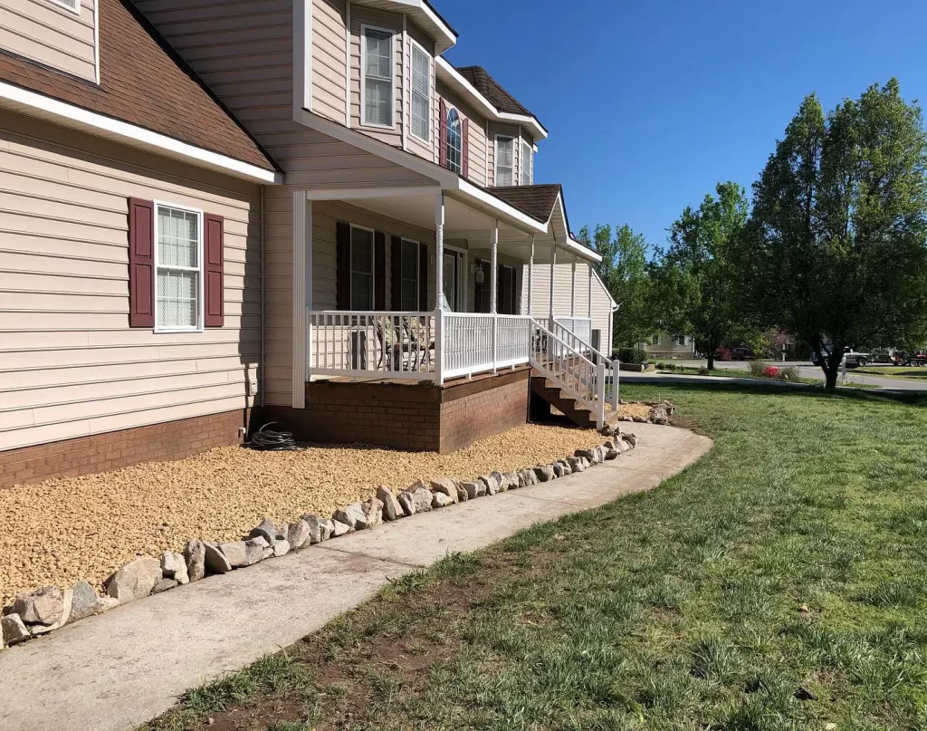Landscaping Services in Chesterfield & Richmond | Peachers house with rock edge border flower bed and rock fill in chesterfield va