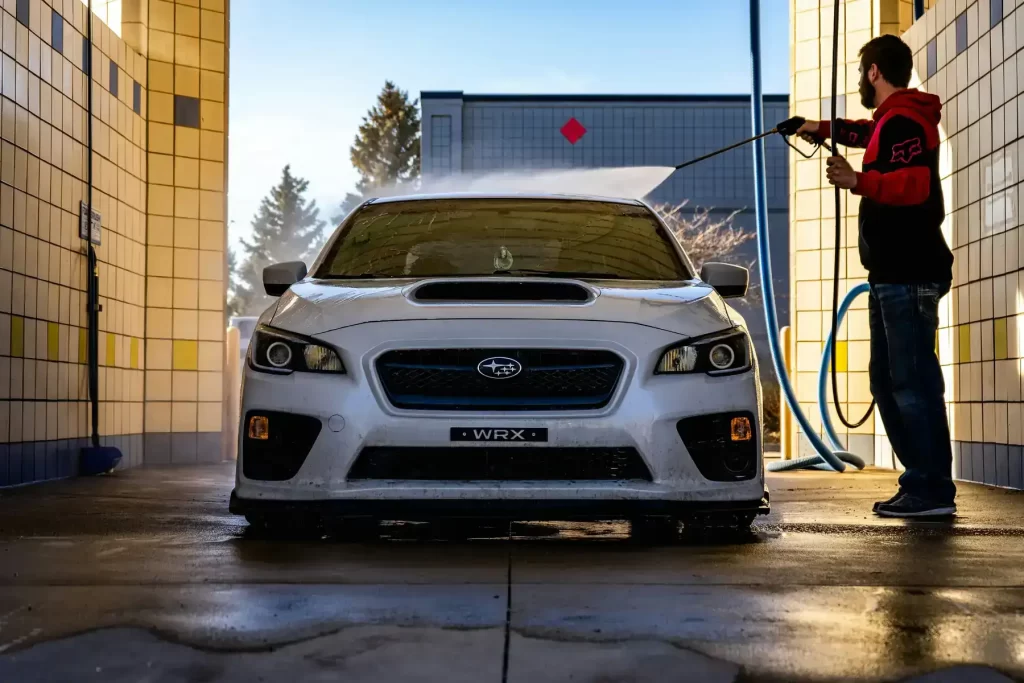 Pressure Washing in Chesterfield & Richmond | Peachers man pressure washing subaru wrx in richmond va
