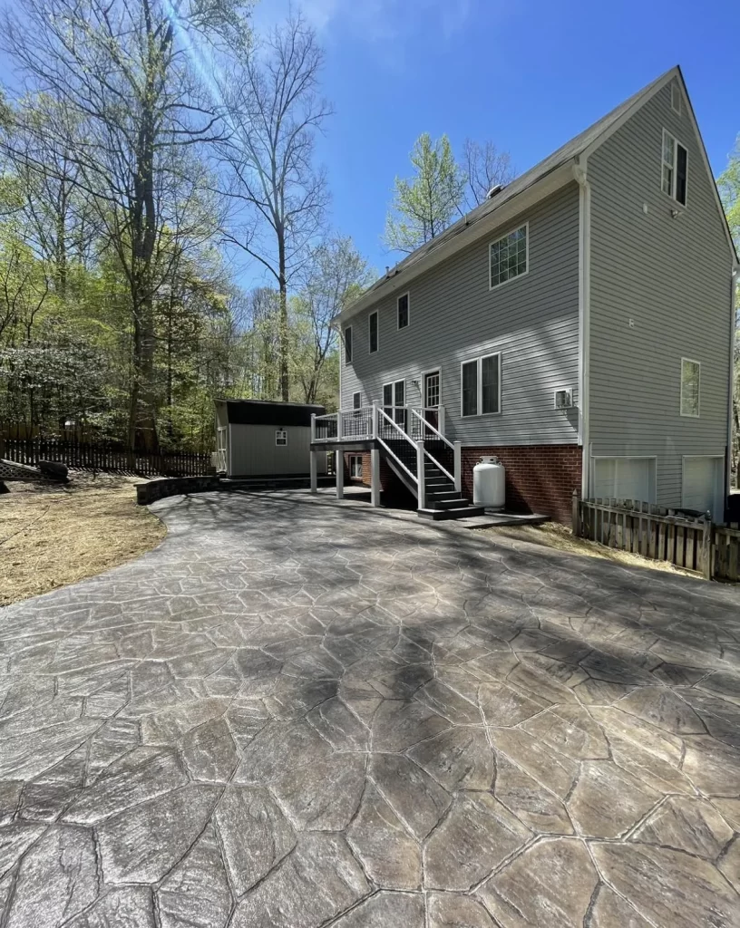 Patios & Concrete in Chesterfield & Richmond | Peachers stamped concrete patio in backyard with composite deck in richmond virginia